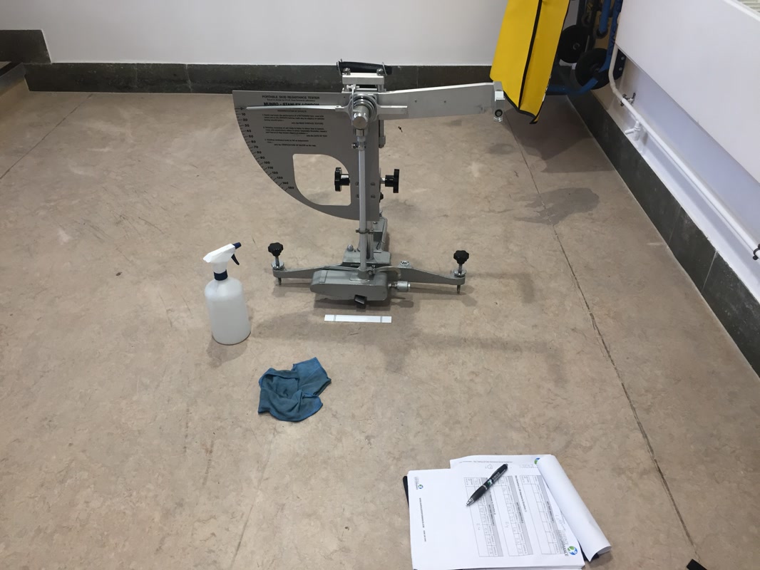 A pendulum slip resistance test being carried out at a school in London by Surface Performance Ltd.